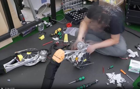 The Artemis humanoid robot standing in a lab environment.