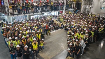 Tesla's First Cybercab Robotaxi Rolls Off the Production Line