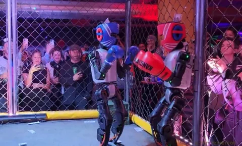 Humanoid Robots Duke It Out in Cyberpunk Cage Match